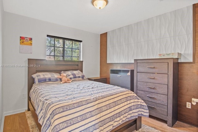 bedroom with light hardwood / wood-style flooring