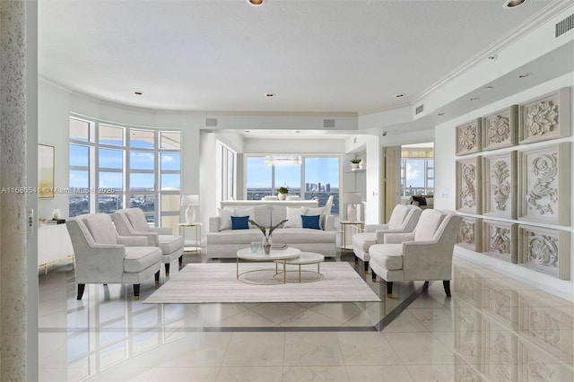 living room featuring a textured ceiling, ornamental molding, and light tile patterned flooring