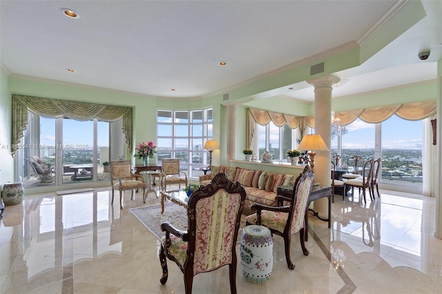 dining space with decorative columns and ornamental molding