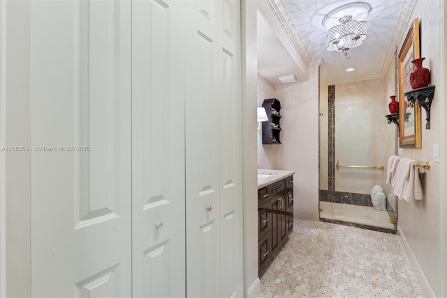 bathroom with vanity, a shower, and crown molding