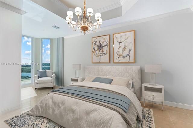 bedroom with a water view, ornamental molding, and an inviting chandelier