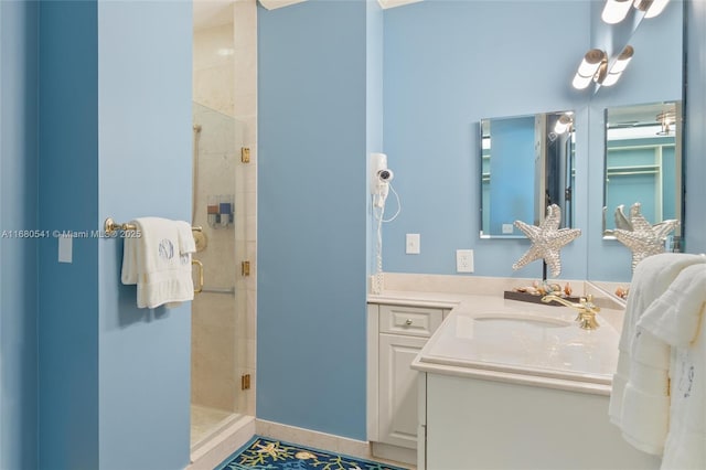 bathroom featuring vanity, tile patterned floors, and a shower with shower door