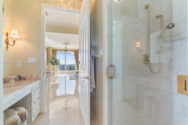 bathroom with vanity, crown molding, a shower with shower door, and tile patterned floors