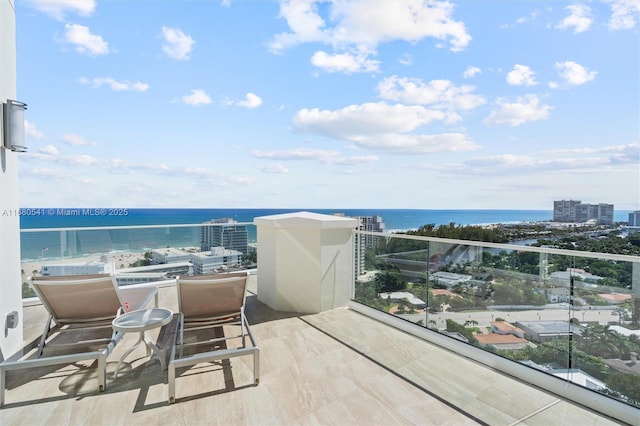 balcony featuring a water view