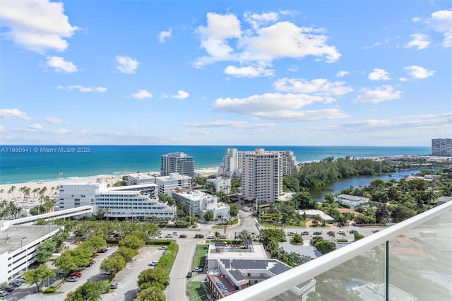 bird's eye view featuring a water view and a view of the beach