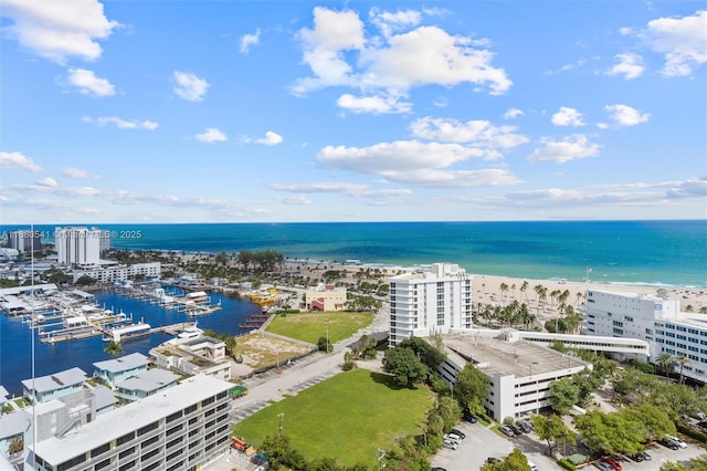 bird's eye view featuring a water view and a view of the beach