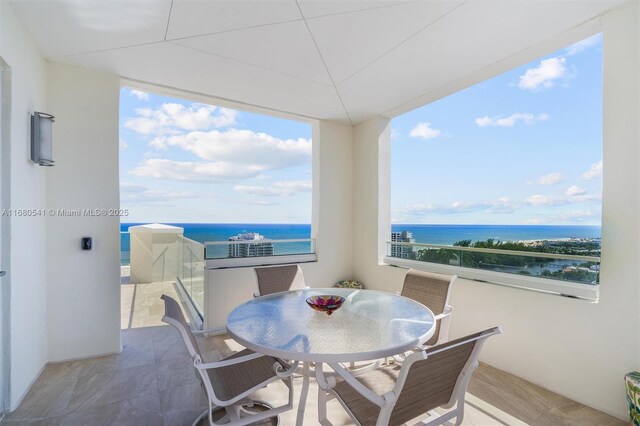 balcony featuring a water view