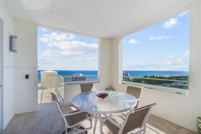 dining space featuring a water view