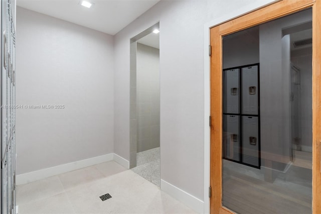 bathroom with tile patterned floors