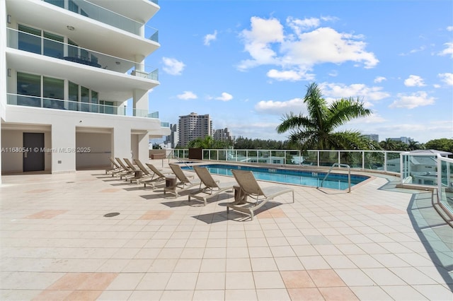 view of swimming pool featuring a patio area