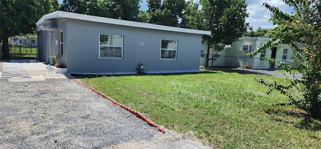 back of house with a yard