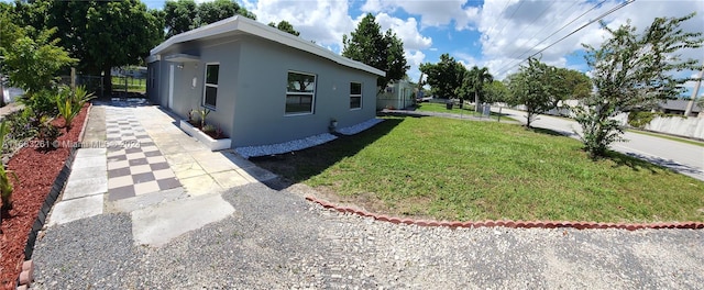 view of home's exterior with a lawn