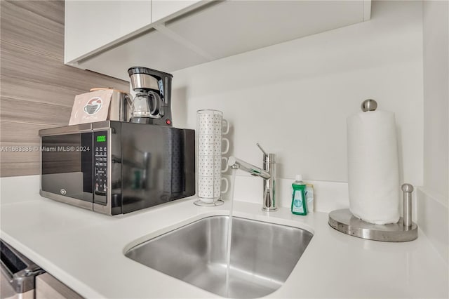 room details with sink and white cabinetry