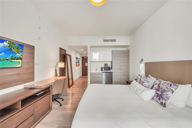 bedroom with light wood-type flooring