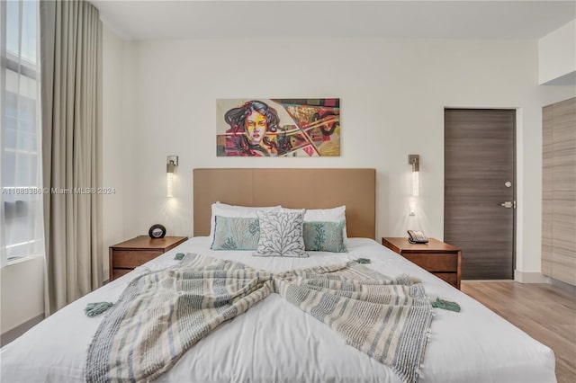 bedroom featuring wood-type flooring