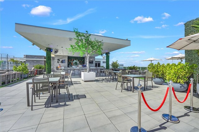 777 N Ocean Dr Unit S316, Hollywood, FL 33019 - view of patio featuring outdoor dining area