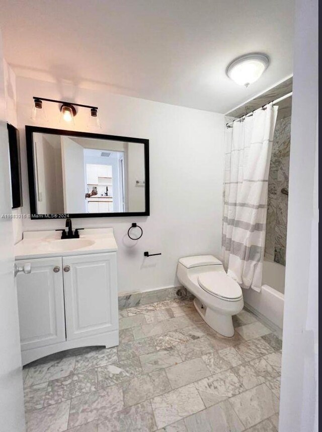 full bathroom with vanity, shower / bath combination with curtain, and toilet