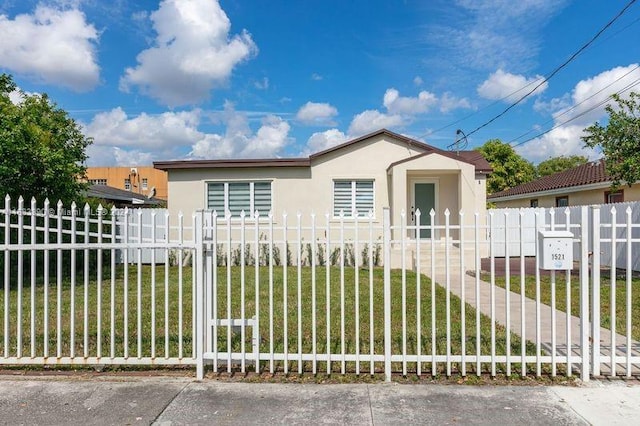 view of front of home with a front lawn