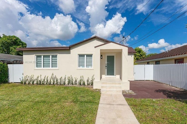 view of front of home with a front yard