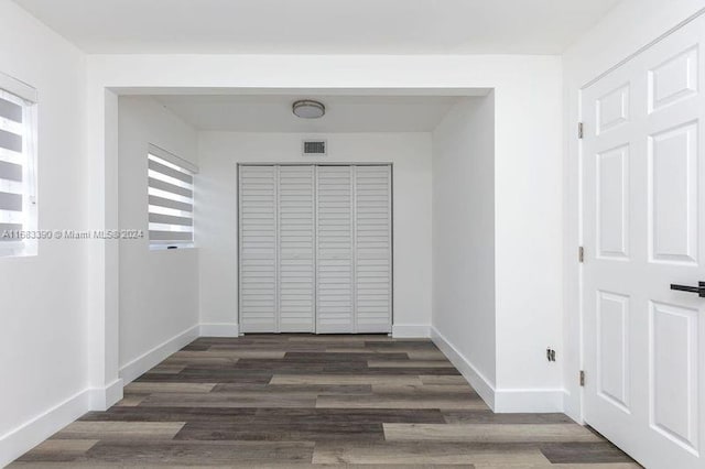 hall with dark hardwood / wood-style floors