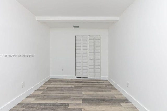 unfurnished room with light hardwood / wood-style flooring