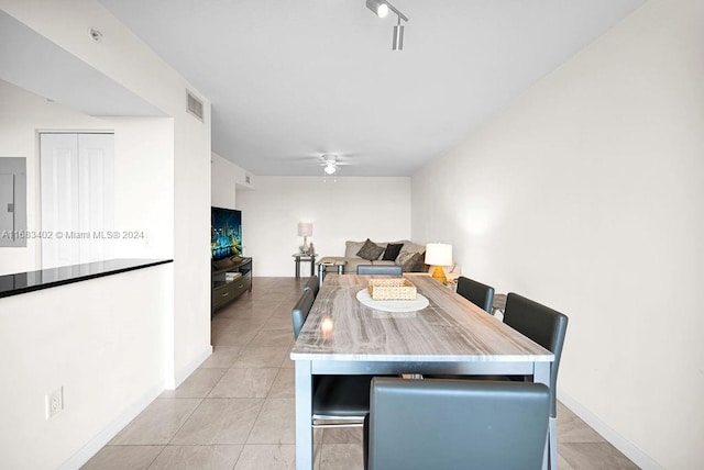 tiled dining area featuring ceiling fan