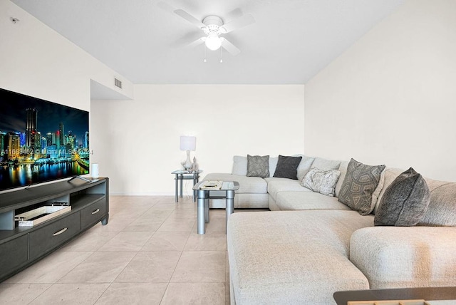 tiled living room featuring ceiling fan