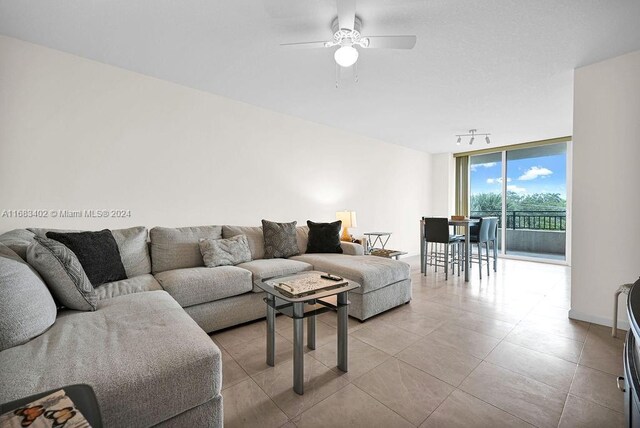 610 W Las Olas Blvd Unit 312N, Fort Lauderdale, FL 33312 - living area featuring expansive windows, ceiling fan, and light tile patterned floors