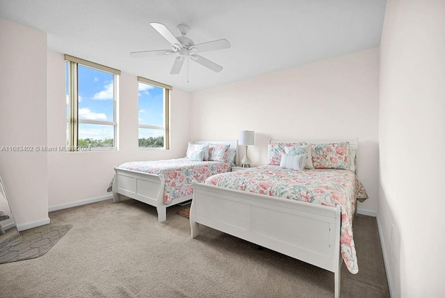 bedroom with light colored carpet and ceiling fan