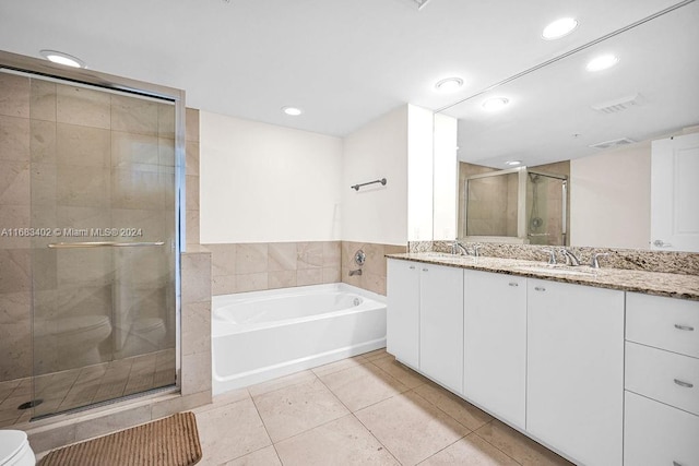 bathroom with vanity, plus walk in shower, and tile patterned floors