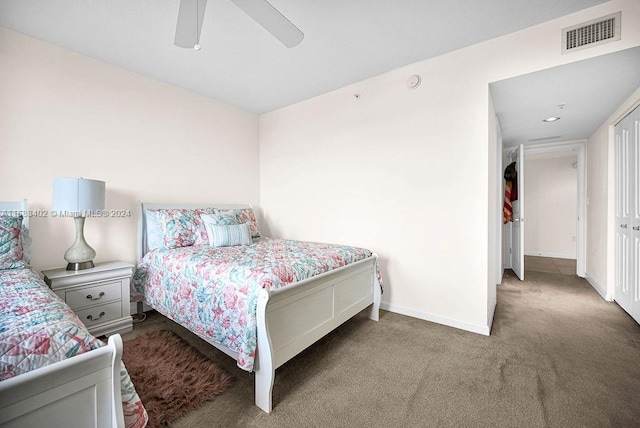 bedroom with a closet, ceiling fan, and carpet flooring