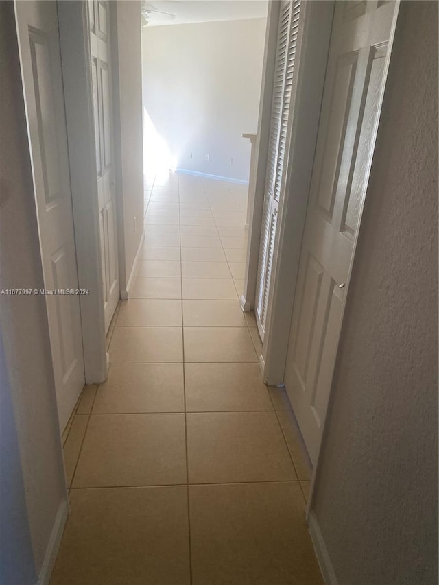 hallway with light tile patterned floors