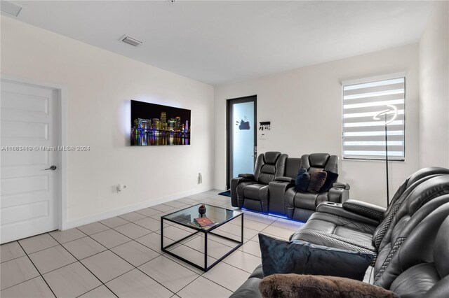 living room with light tile patterned flooring