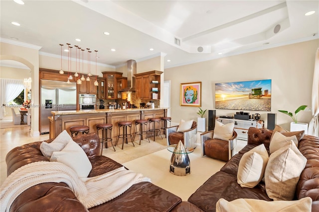 living room with ornamental molding and light tile patterned flooring