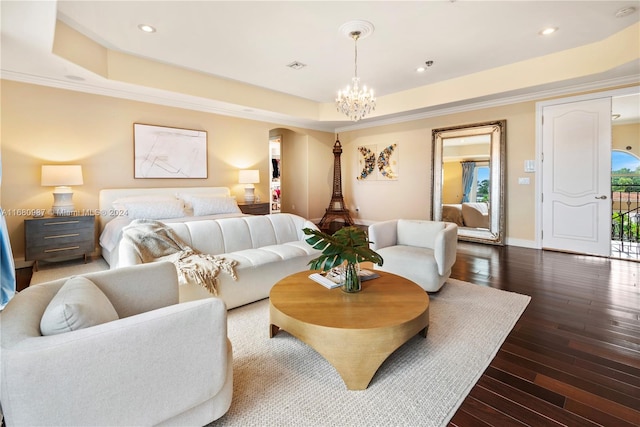 bedroom featuring crown molding, access to exterior, dark wood-type flooring, and a raised ceiling