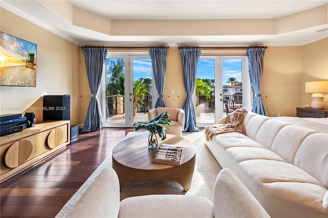 living room featuring french doors, plenty of natural light, and dark hardwood / wood-style floors