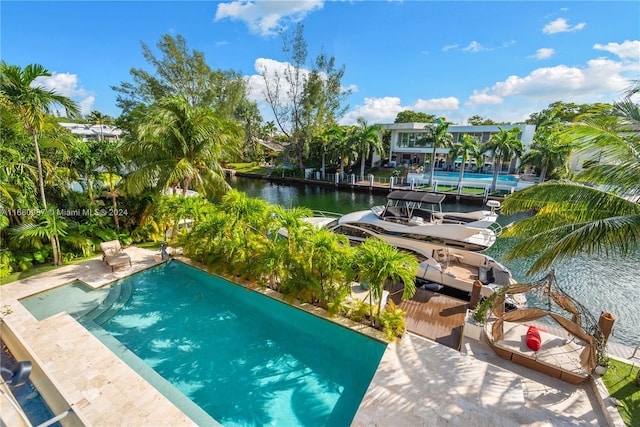 view of swimming pool featuring a water view