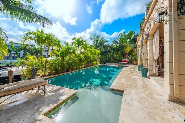 outdoor pool featuring a patio area