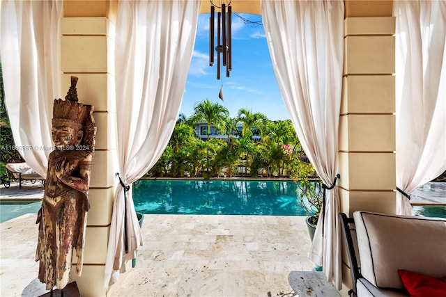 view of swimming pool with a patio