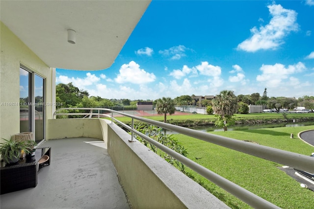 balcony featuring a water view