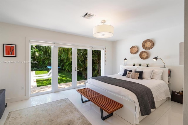 tiled bedroom with access to outside and multiple windows