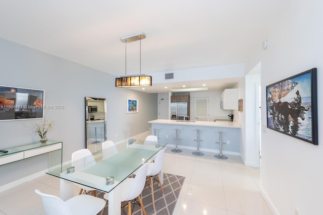 dining room featuring light tile patterned floors