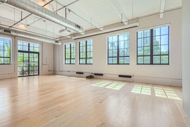 unfurnished room with light hardwood / wood-style flooring