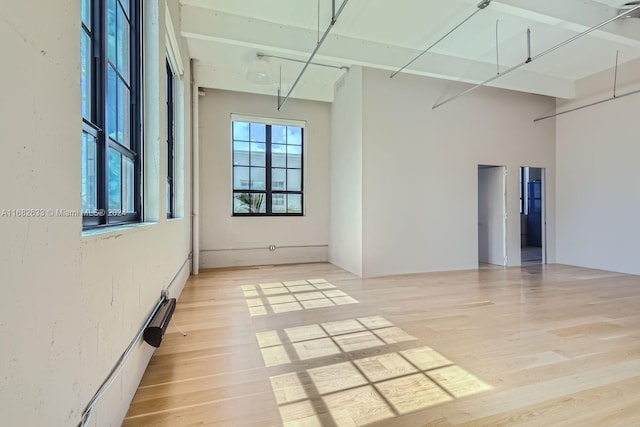 spare room featuring light hardwood / wood-style floors