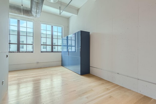 spare room featuring hardwood / wood-style floors