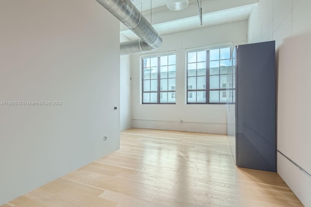 spare room with light hardwood / wood-style floors