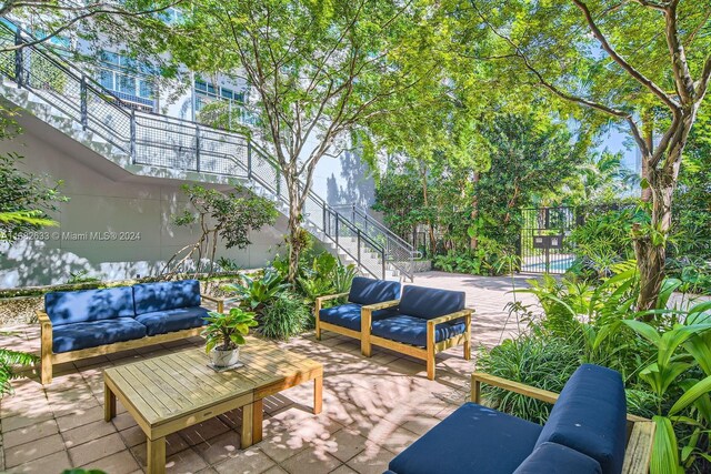 view of patio / terrace with an outdoor living space and a balcony