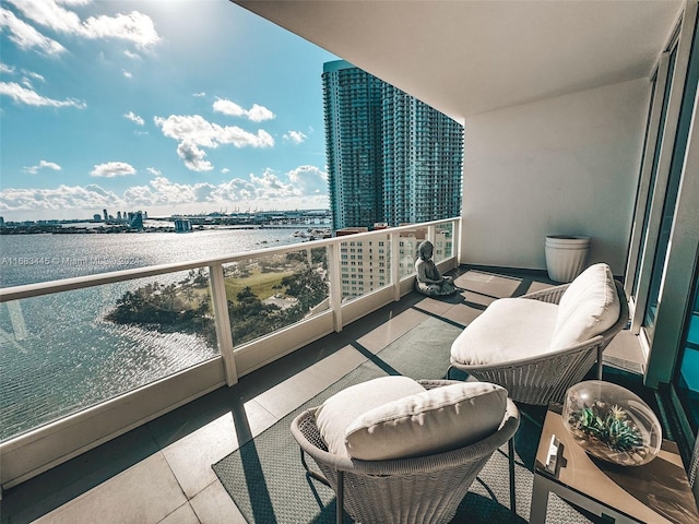 balcony featuring a water view