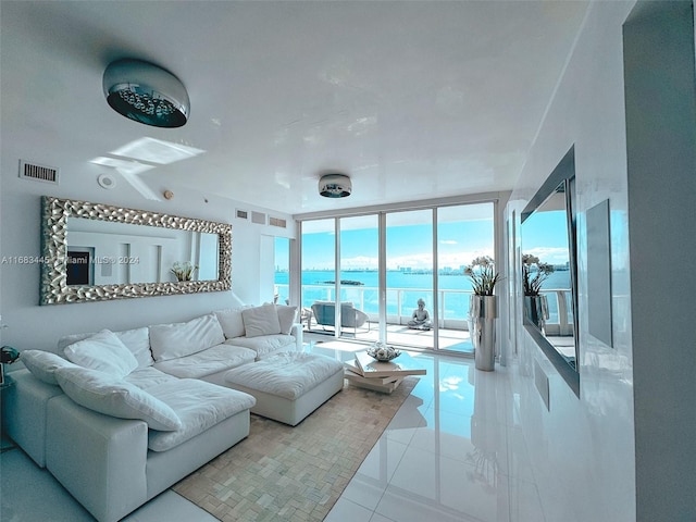 2020 N Bayshore Dr Unit 2007, Miami, FL 33137 - tiled living area with visible vents, floor to ceiling windows, and a water view