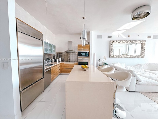 2020 N Bayshore Dr Unit 2007, Miami, FL 33137 - kitchen featuring modern cabinets, stainless steel appliances, backsplash, wall chimney range hood, and open floor plan